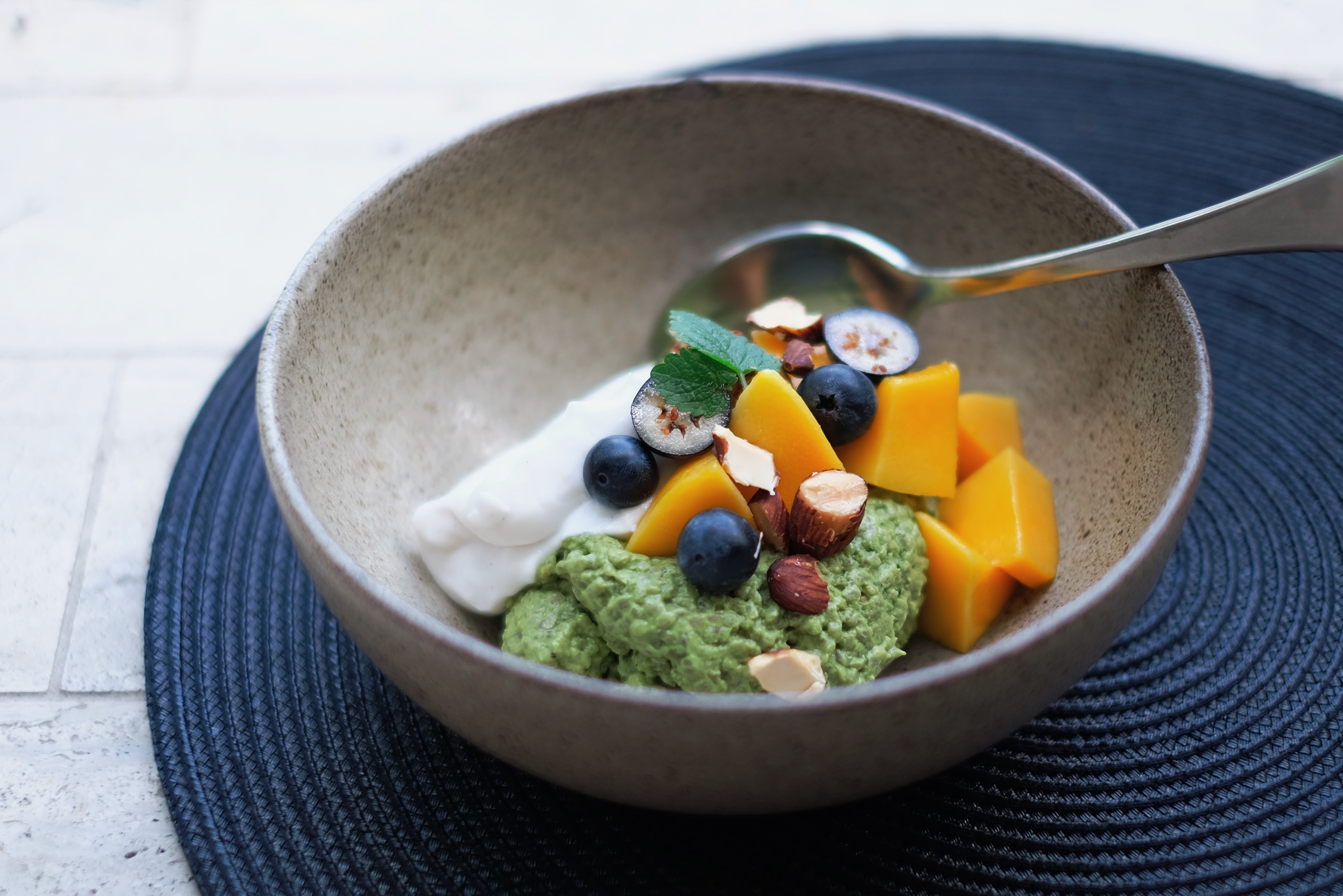 Chia pudding with matcha, coconut & seasonal fruit